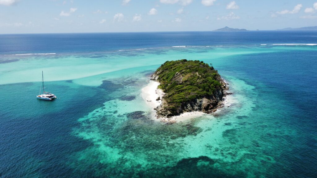Saint Vincent and the Grenadines - Tropical Paradise. A small Island surrounded by Green Blue water.